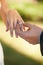 Closeup, wedding and hands with a ring, couple or love ceremony with happiness, commitment or loving. Zoom, groom or