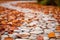 Closeup Of White Flat Rock Pathway On Beige Background Next To Autumn Leaves. Generative AI