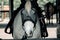 Closeup of a white harnessed horse with black spots