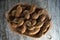 Closeup of whole tamarind fruits in wooden bowl