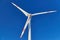 Closeup of a wind turbine nacelle on blue sky. Closeup of a wind power plant on blue sky