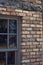 Closeup of Window, Brick, and Log Beam