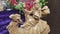 Closeup of a wiseman on a camel Christmas decoration in front of floral arrangement