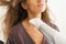 Closeup on woman blow drying hair