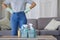 Closeup of woman, cleaning and basket with product in living room, lounge and home of housekeeping, maintenance or