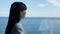 Closeup woman director thinking ocean window view. Luxury vacation concept