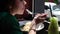 Closeup of woman eating pasta bolognese at italian care or restaurant