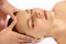 Closeup woman enjoying relaxing anti-stress head massage. Quiescent