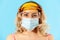 Closeup woman face wearing hygienic surgical mask, protective eyeglasses to prevent contagious coronavirus