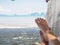 Closeup woman feet lying on hammock with trees and beautiful sea