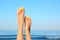 Closeup of woman  flip flops near sea, space for text. Beach accessories