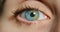Closeup of woman with green and blue eyes or contact lens for vision, eyecare or eyesight awareness. Macro of medical