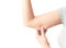 Closeup woman hand checking upper arm on white background health