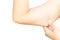 Closeup woman hand checking upper arm on white background health