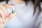 Closeup woman hand holding one antibiotic pill