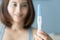 Closeup woman hand holding pregnancy test with happy moment, health care concept, selective focus