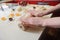 Closeup of woman hand with rolling baking cookies