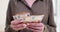 Closeup of woman hands counting 50 euro bills