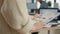 Closeup of woman hands holding clipboard with papers looking at pie chart and business profit data