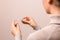 Closeup woman hands holding a glass thermometer with high temperature above thirty eight. coronavirus symptoms