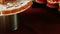 Closeup woman hands put mini glaze chocolate desserts on candy bar table