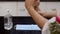 Closeup of a woman hands sanitizing her hands using a sanitizer - hygiene concept