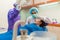 Closeup woman having dental teeth examined dentist check-up via excavator