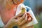 Closeup of Woman holding a baby chick in her hands very carefully