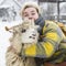 Closeup woman hugging a sheep