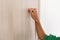 Closeup of woman knocking on the wooden door