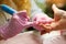 Closeup woman manicurist doing nail treatment