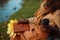 Closeup on woman with notebook, yellow leaves drinking coffee