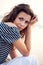 Closeup woman portrait sitting on ground