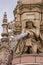 Closeup of woman pouring water, Doulton Fountain, Glasgow Scotland UK.