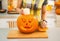 Closeup on woman putting candle inside pumpkin Jack-O-Lantern