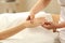 Closeup of a woman receiving a hand massage in a spa