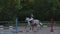 Closeup of a woman in riding gear sitting in a saddle on a chestnut horse horse while out for ride in the countryside.