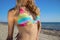 Closeup of woman\'s body in colorful striped bikini