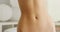 Closeup of woman\'s flat stomach