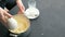 Closeup woman`s hand making mashed potato with mixer in saucepan. Cooking mashed potatoes.