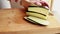 CloseUp of Woman\\\'s Hands Cutting Eggplant