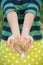 Closeup of woman`s hands holding bunch of golden ears of wheat . Harvest. Summer. Farming