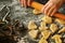 Closeup of woman`s hands working with dough and making biscuits