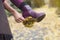 Closeup of woman\'s shoe with leaves stuck on her heal