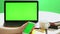 Closeup woman sitting table notebook female hands keyboarding laptop using texting pointing networking green screen