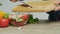 Closeup of woman slices mushrooms for diet salad.