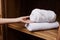 Closeup woman stack towel care hands female hygiene hotel health home white room clean