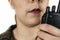 Closeup of a woman talking on a walkie talkie