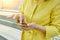 Closeup of womans hand with smartphone, fingers on touchscreen, text message