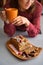 Closeup of womans hands holding mug with home-made baking